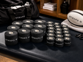 Black STRAPD EAB and Zinc Oxide sports tape rolls in a sports changing-room setting